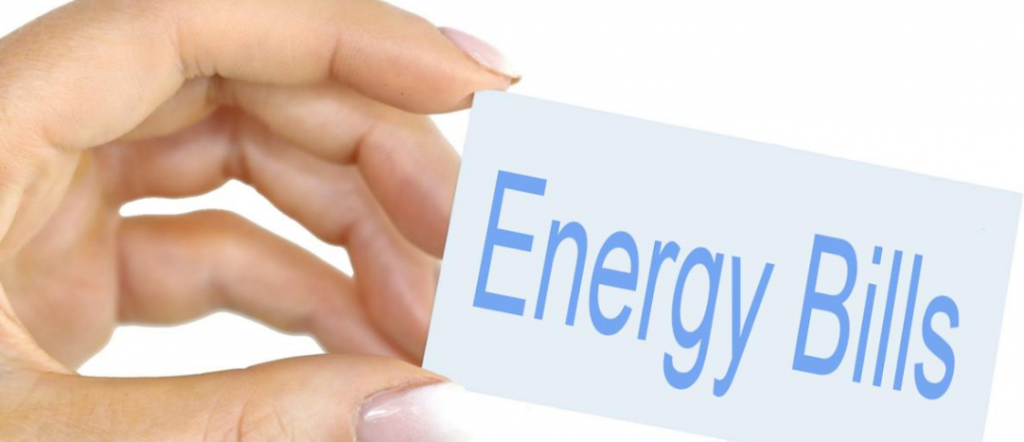 Hand holding card with the words Energy Bills